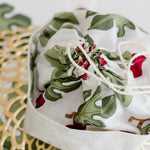Bread bag with fig design on a gold lacemat placemat