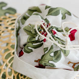 Bread bag with fig design on a gold lacemat placemat