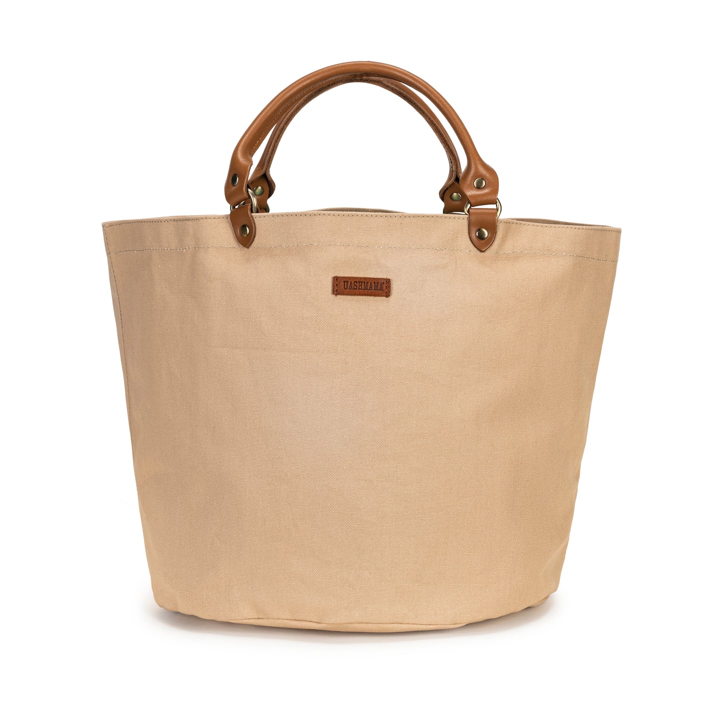 A round shaped tan cotton tote bag with short leather handles and a small leather logo badge