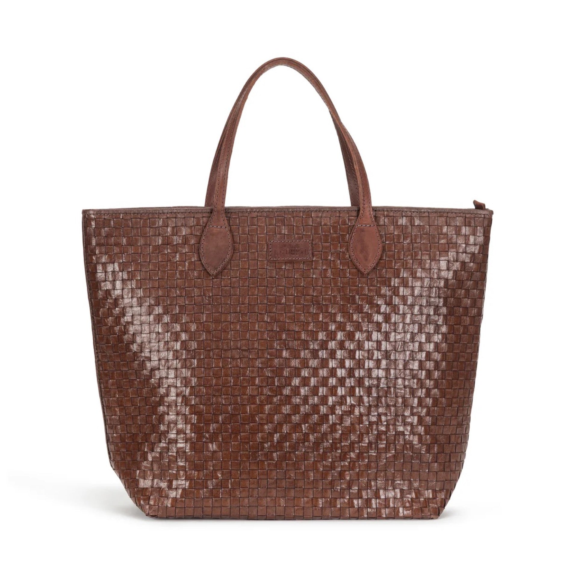 Brown woven handbag on a white background