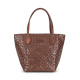 Woven brown handbag with brown leather handles on a white background