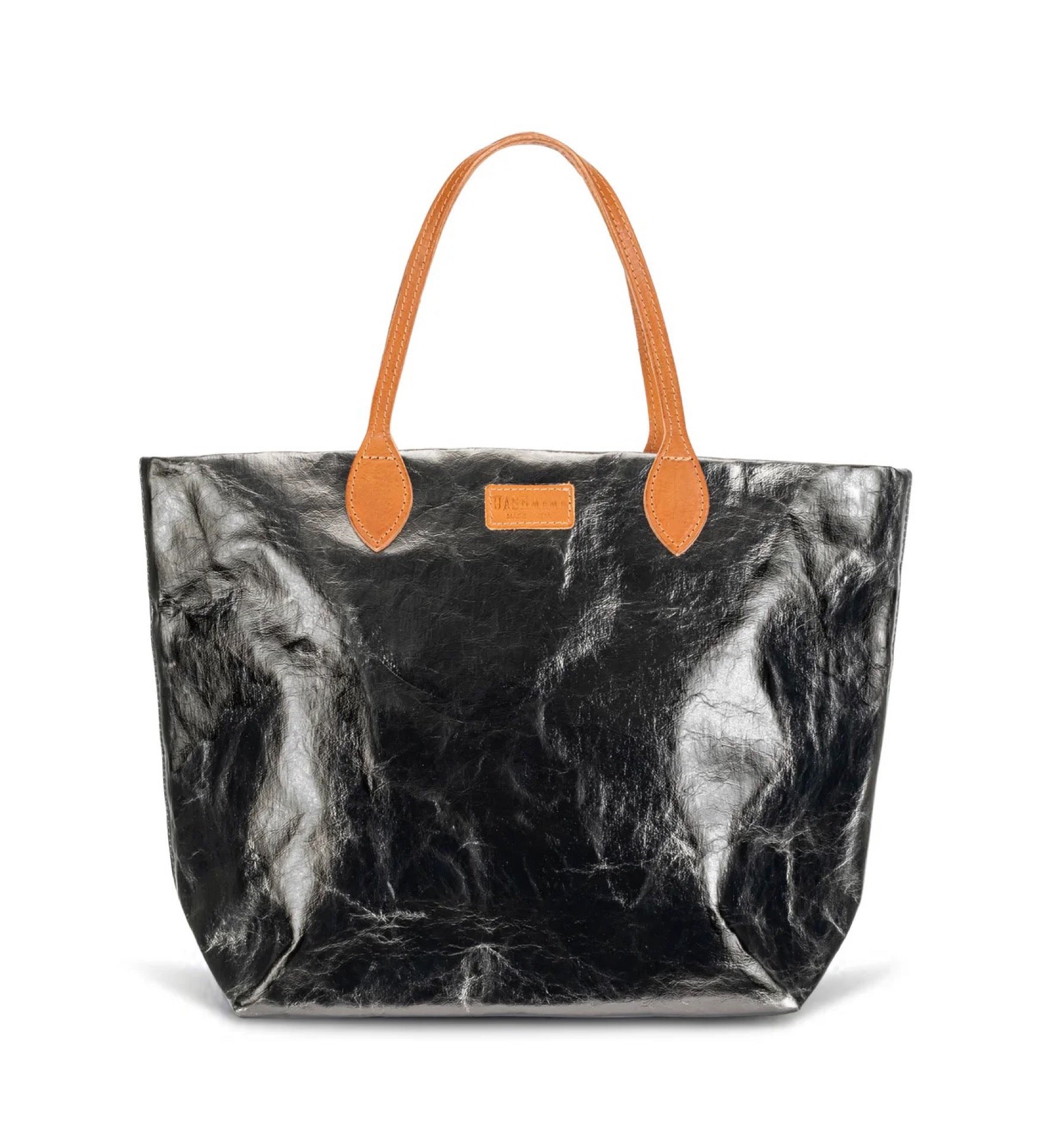 Metallic dark grey tote bag with brown handles on a white background