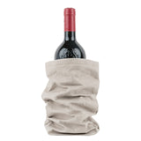 A bottle of red wine is shown inside a grey washable paper wine holder.