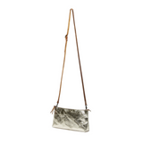 A gold metallic washable paper small zip top handbag is shown with a long brown washable paper strap.