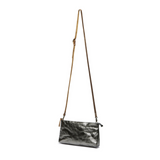 A black metallic washable paper small zip top handbag is shown with a long brown washable paper strap.