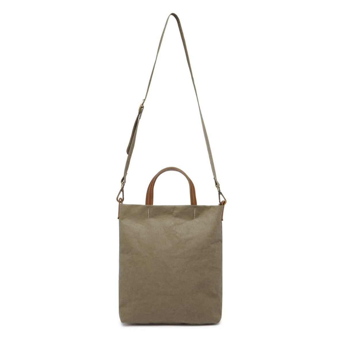 A washable paper tote is shown with a long shoulder strap pointing skywards. It has two top handles and is khaki in colour.