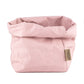 A washable paper bag is shown. The bag is rolled down at the top and features a UASHMAMA logo label on the bottom left corner. The bag pictured is the large plus size in pale pink.