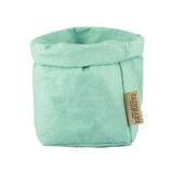 A washable paper bag is shown. The bag is rolled down at the top and features a UASHMAMA logo label on the bottom left corner. The bag pictured is the small size in pale turquoise.