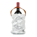 A red wine bottle is shown inside a silver metallic washable paper wine bag. The bag has a small brown leather handle at the top for carrying.