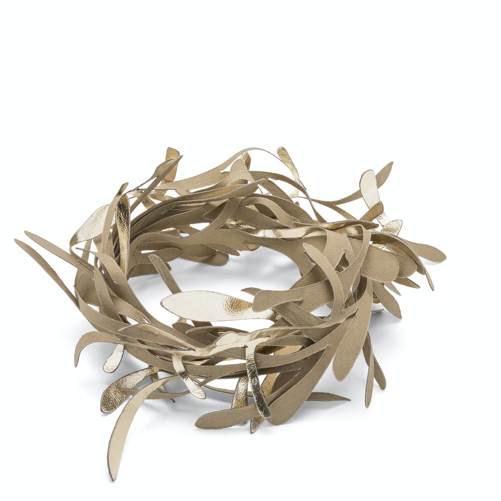 A washable paper garland wreath is shown in metallic gold and beige.