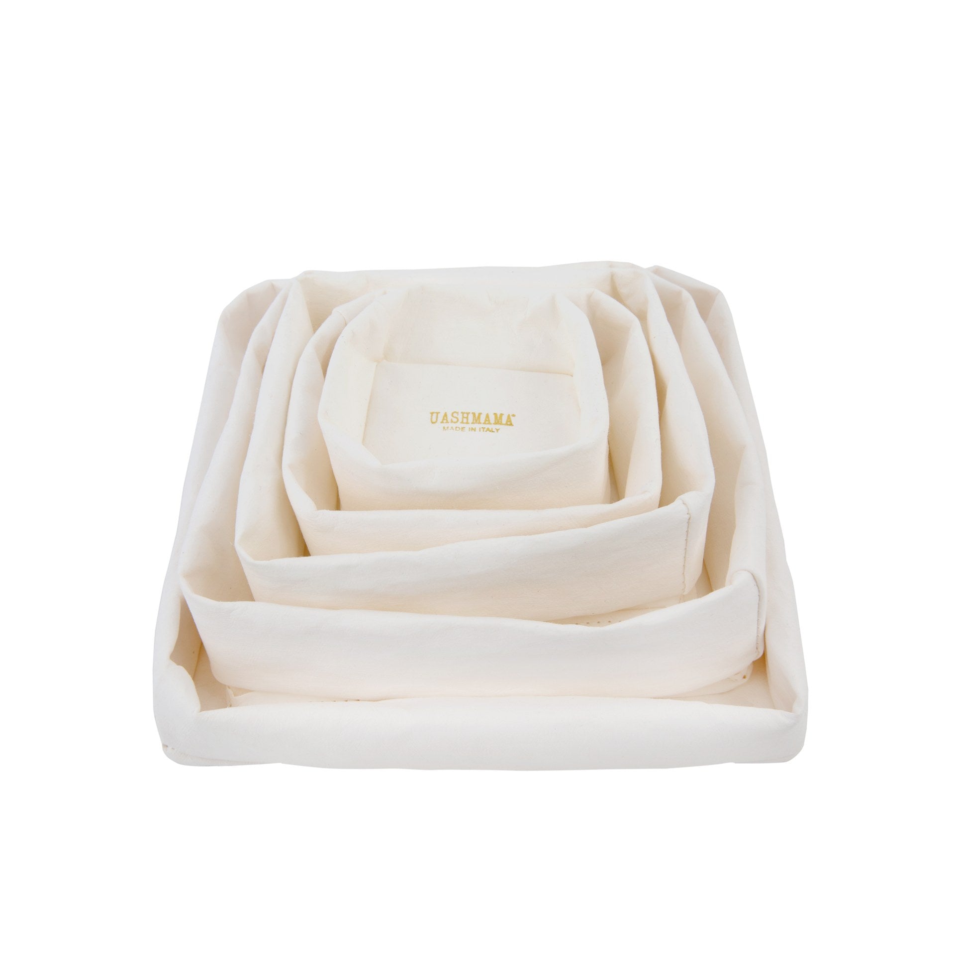 A stack of five washable paper trays is shown in white, one inside the other as a nest. 