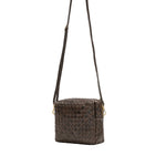 A small woven washable paper handbag is shown with a long washable paper shoulder strap. The bag shown is dark brown.