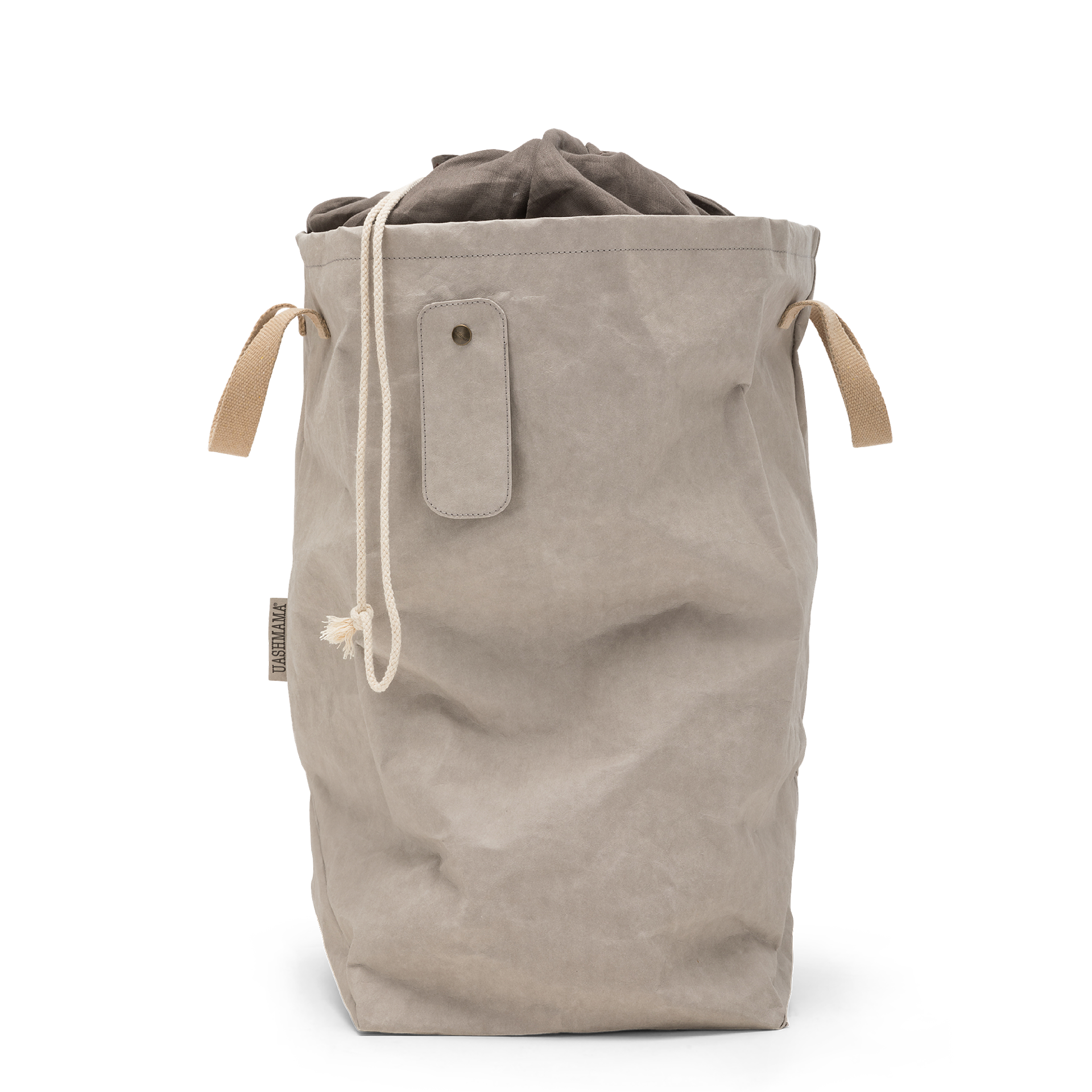 A washable paper laundry bag is shown in beige. It features two side handles, a popper tab, and an interior drawstring lining.