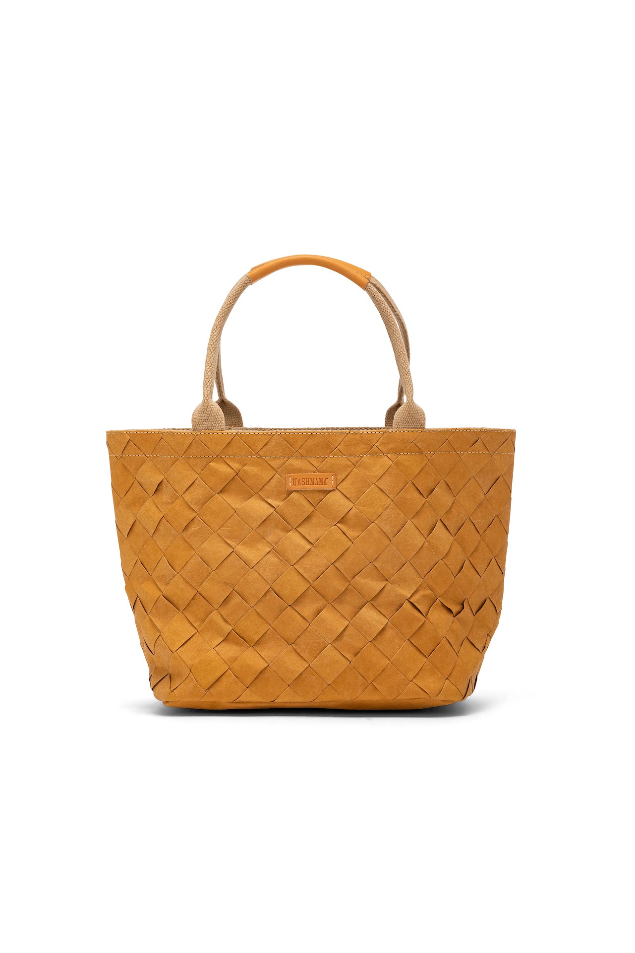 A woven tote in camel washable paper with canvas and leather handles.
