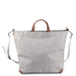 A square grey washable paper tote bag is shown with one long grey shoulder strap and two small tan handles. The corners of the bag are protected by brown corners.