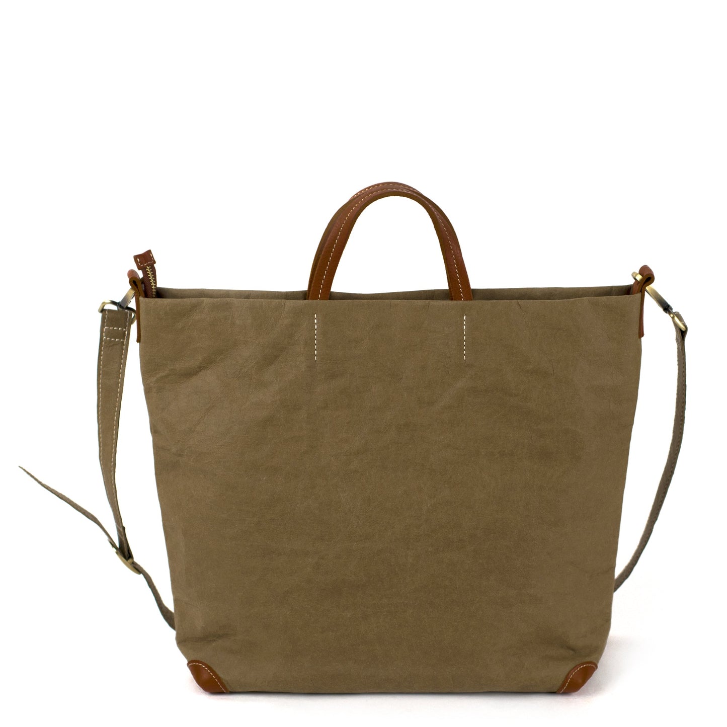 A square olive washable paper tote bag is shown with one long olive shoulder strap and two small tan handles. The corners of the bag are protected by brown corners.