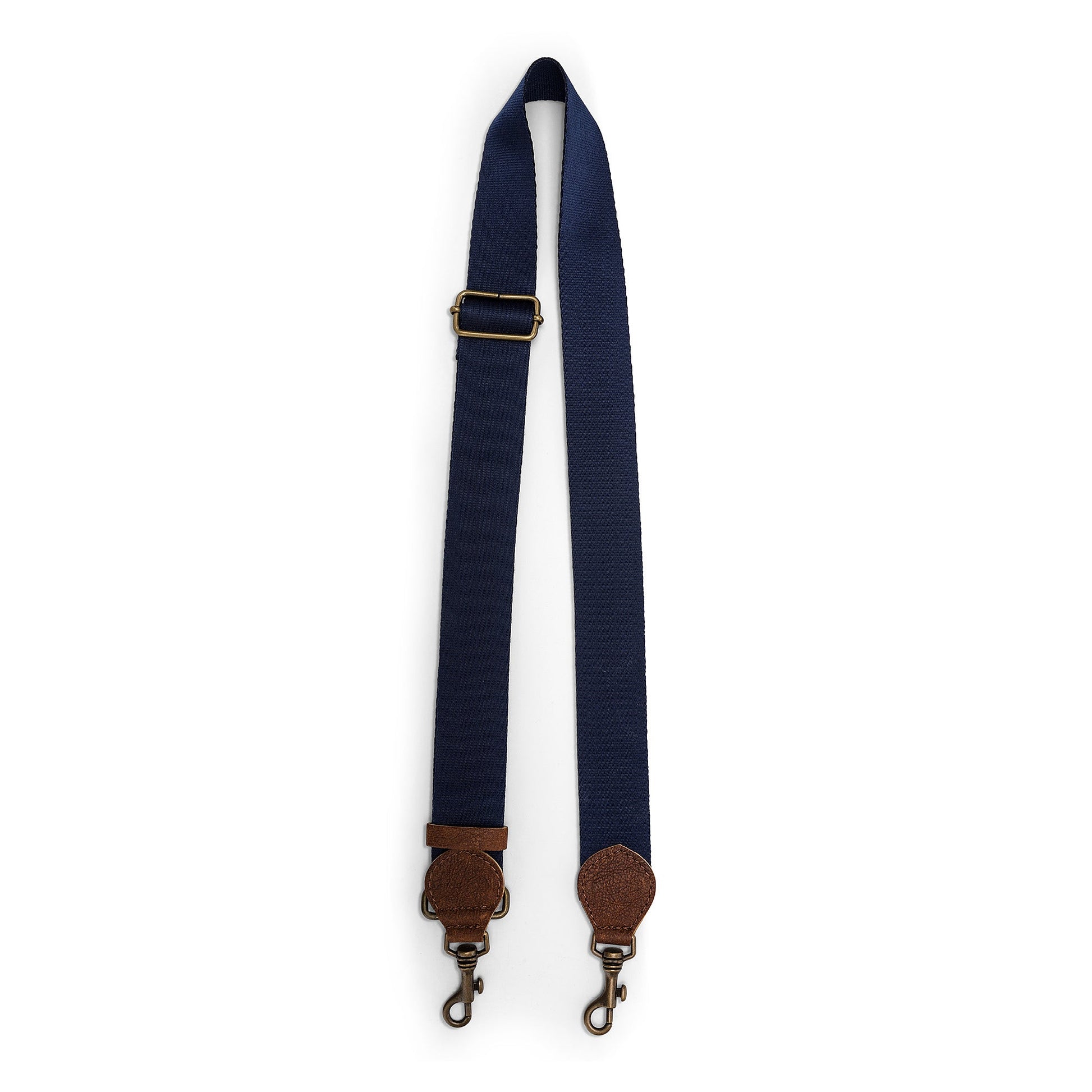 A navy bag strap is shown. The strap shows a brass adjuster, washable paper details and metal retractable fasteners.