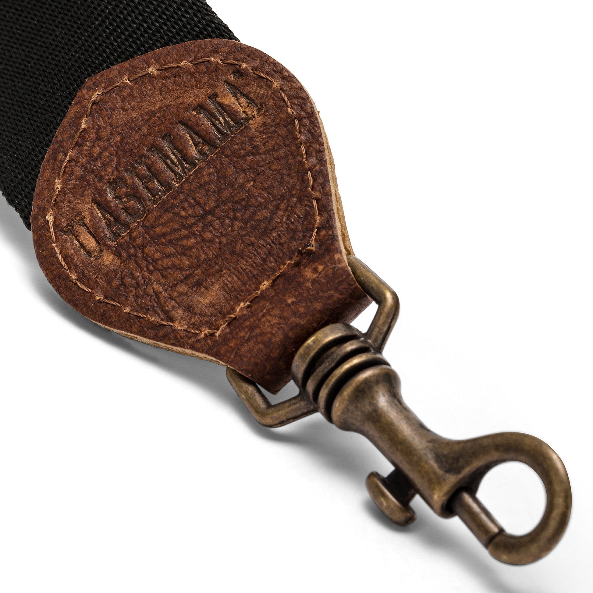 A black strap is shown with washable paper details and a metallic retractable clip.