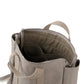 A grey washable paper backpack is shown from a top angle, with a beige lining and inner pockets. 