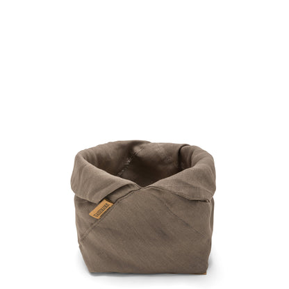 A brown linen bread bag is shown with the top rolled down, open. A brown logo UASHMAMA tag features on the front side.