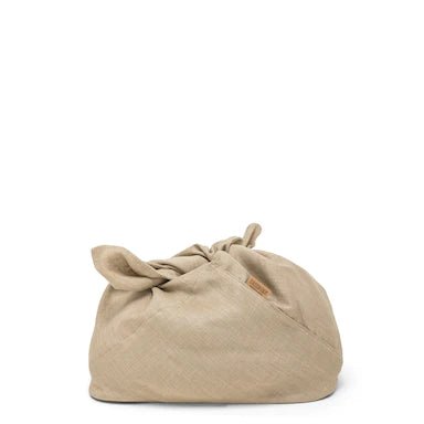 A large natural toned linen bread bag is shown with tied handles and a tan UASHMAMA logo tab at the front right side.