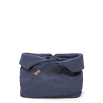 A large navy bread bag is shown with the top rolled down.