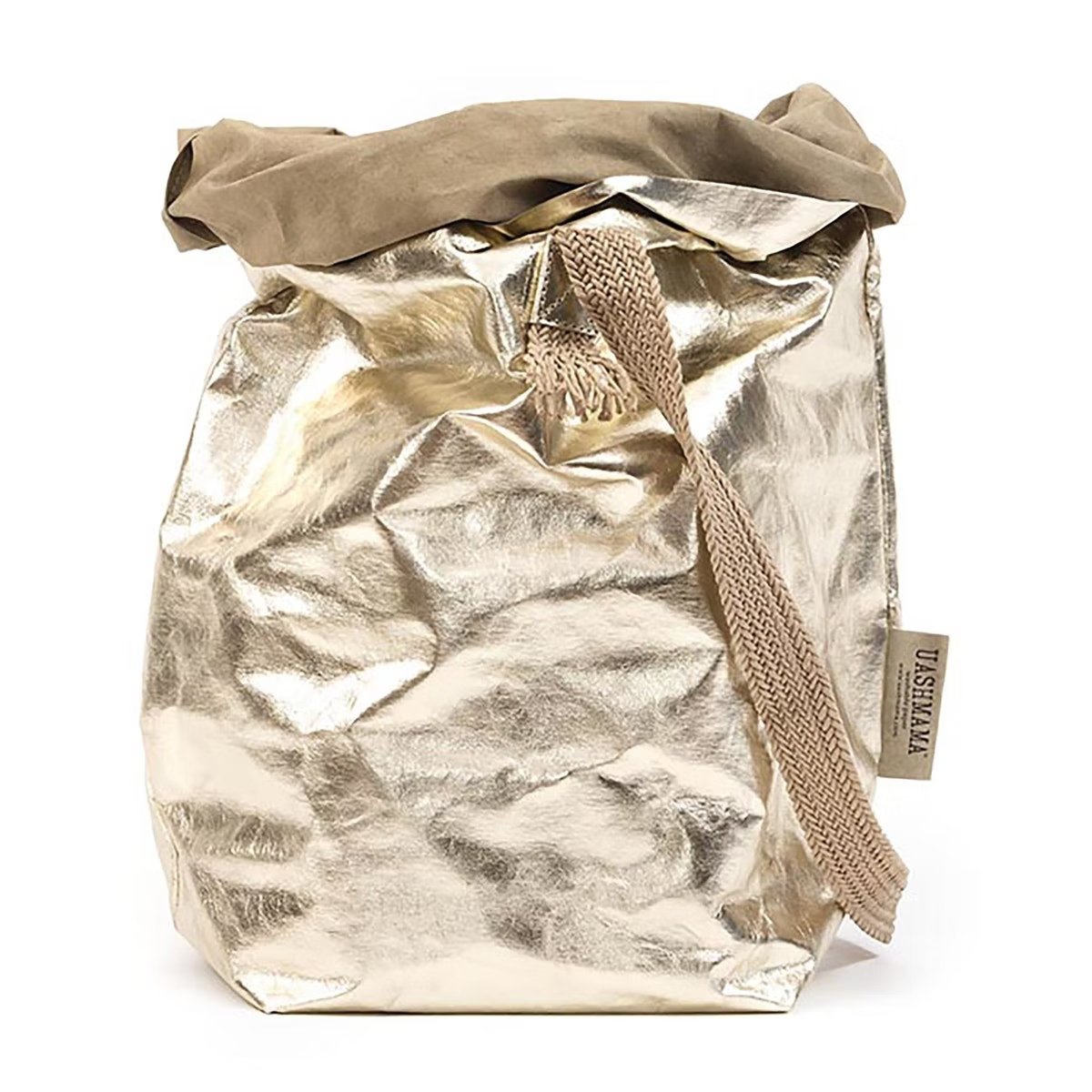 A gold metallic washable paper bag with a single cotton carry strap in a natural tone. The top is displayed open and rolled down, with a natural toned UASHMAMA logo tab on the right hand side.