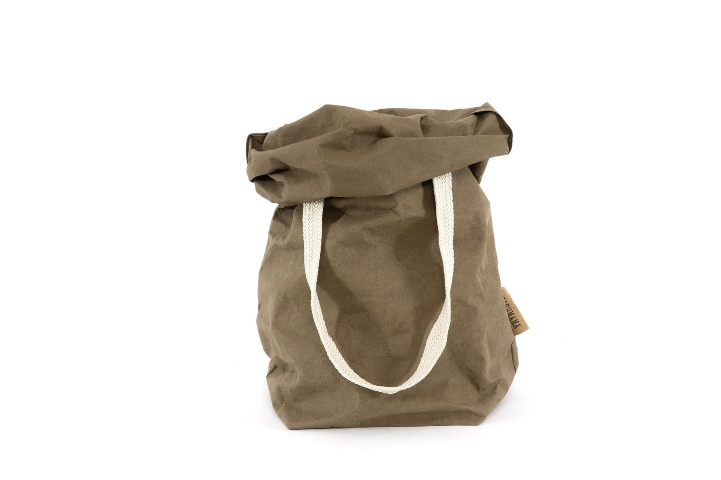 A khaki washable paper bag is shown from the front with the top rolled down. It features two cream cotton straps (one visible in this image) and a natural toned UASHMAMA logo tab at the left hand side.