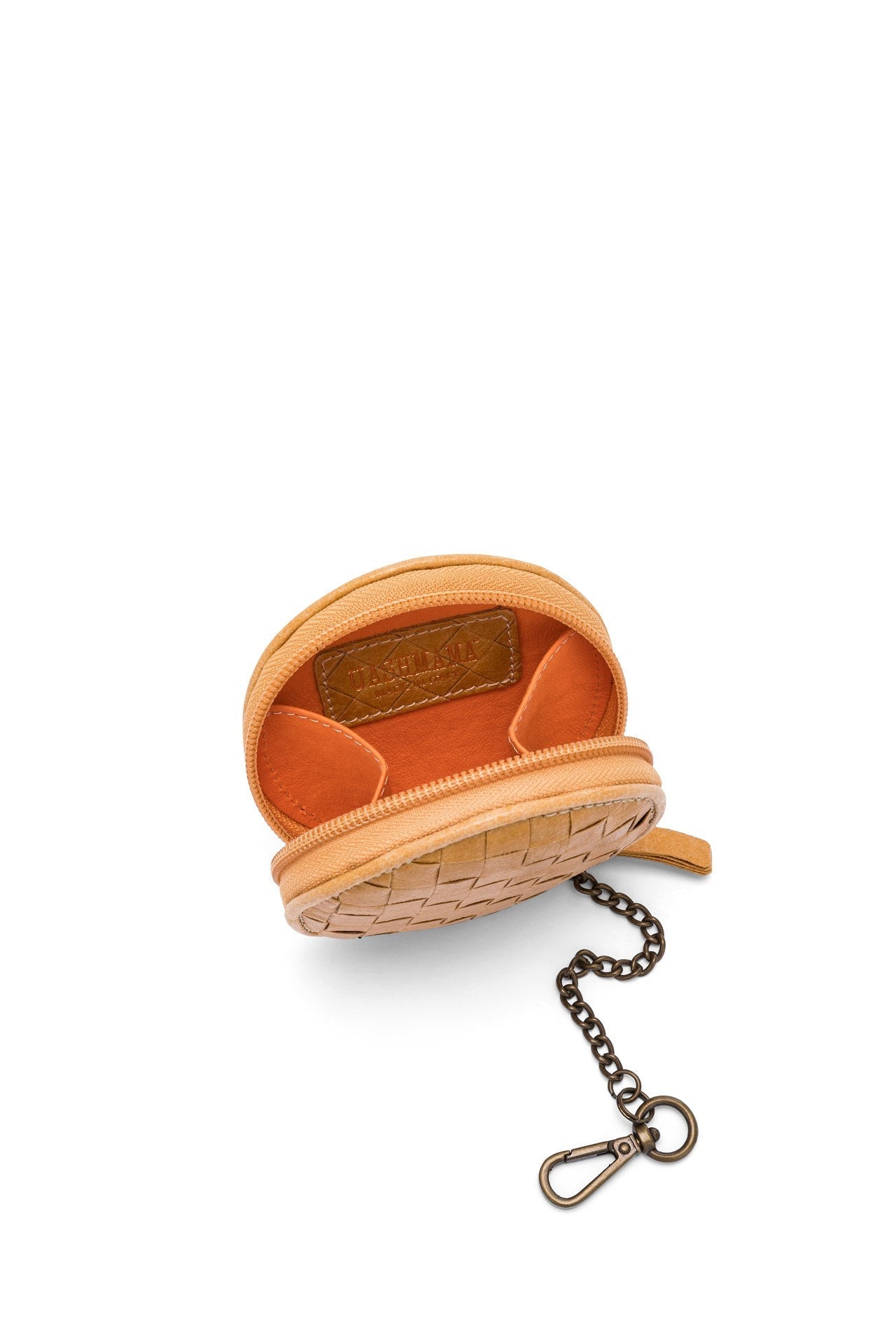 A tan woven washable paper round coin purse is shown from the front at a top-down angle. It features an orange interior and a brown UASHMAMA logo stamp on the inside.