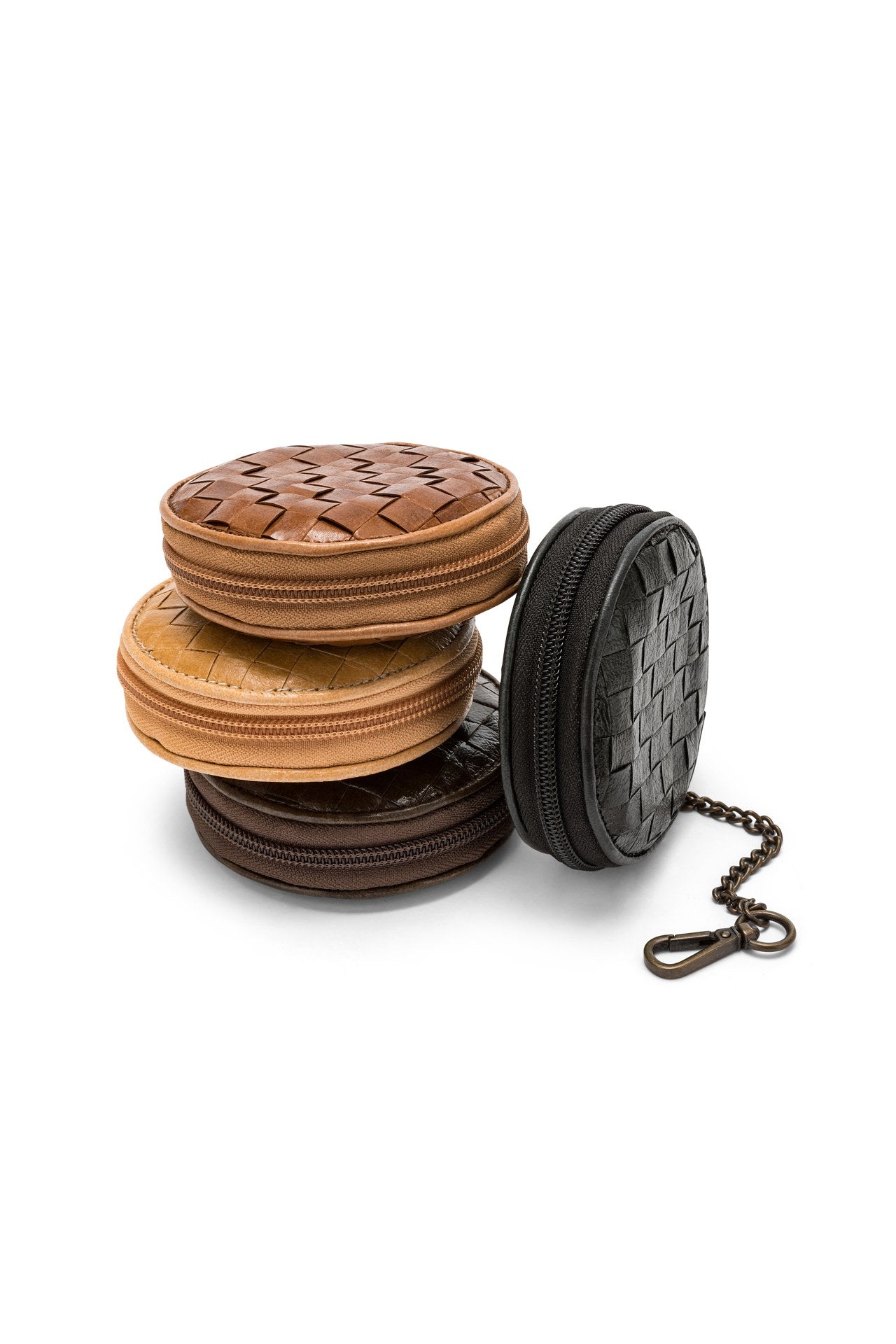 A set of woven washable paper coin purses is shown stacked in chocolate brown, pale tan and medium brown. A black washable paper woven coin purse sits on its side at right, with an antique brass chain and hook attachment closure.
