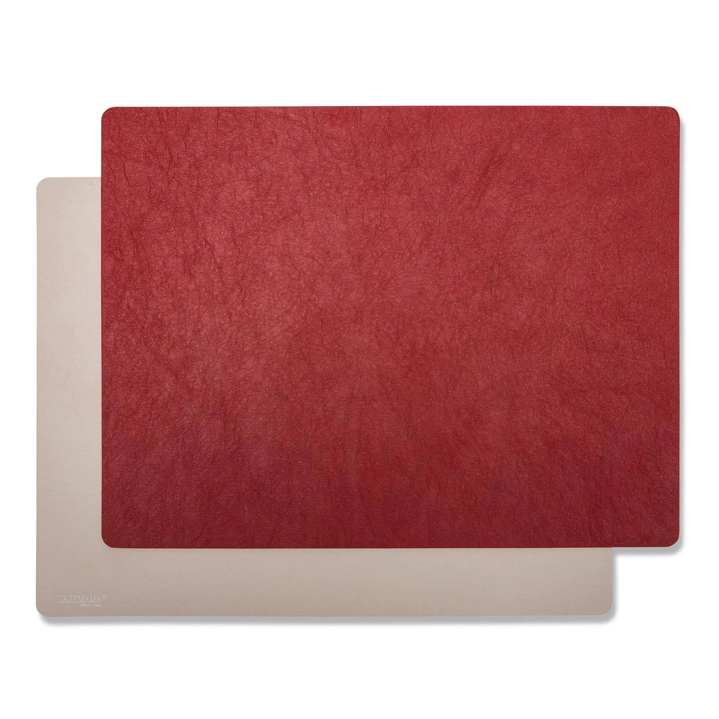 Two rectangular washable paper placemats are stacked one on top of the other. The one in the foreground is red and the one at rear is beige.