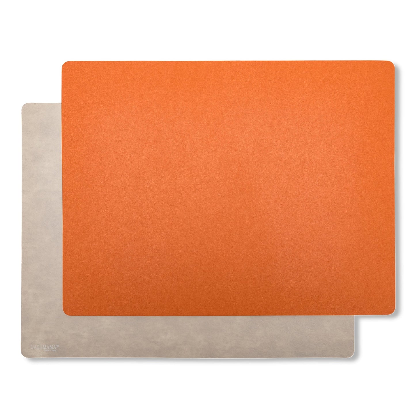 Two rectangular washable paper placemats are stacked one on top of the other. The one in the foreground is orange and the one at rear is beige.