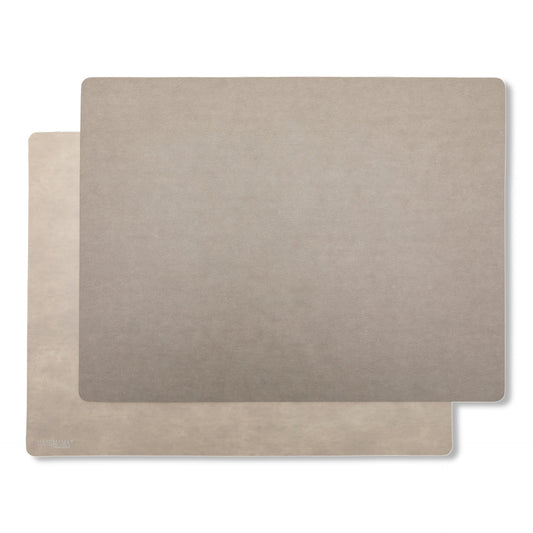 Two rectangular washable paper placemats are stacked one on top of the other. The one in the foreground is grey and the one at rear is beige.