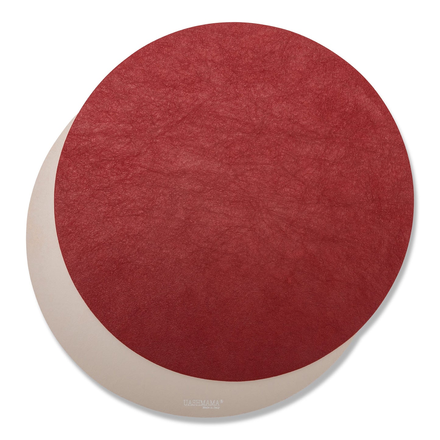 Two round washable paper placemats are shown one on top of the other. The one in the foreground is red and the one at rear is beige.