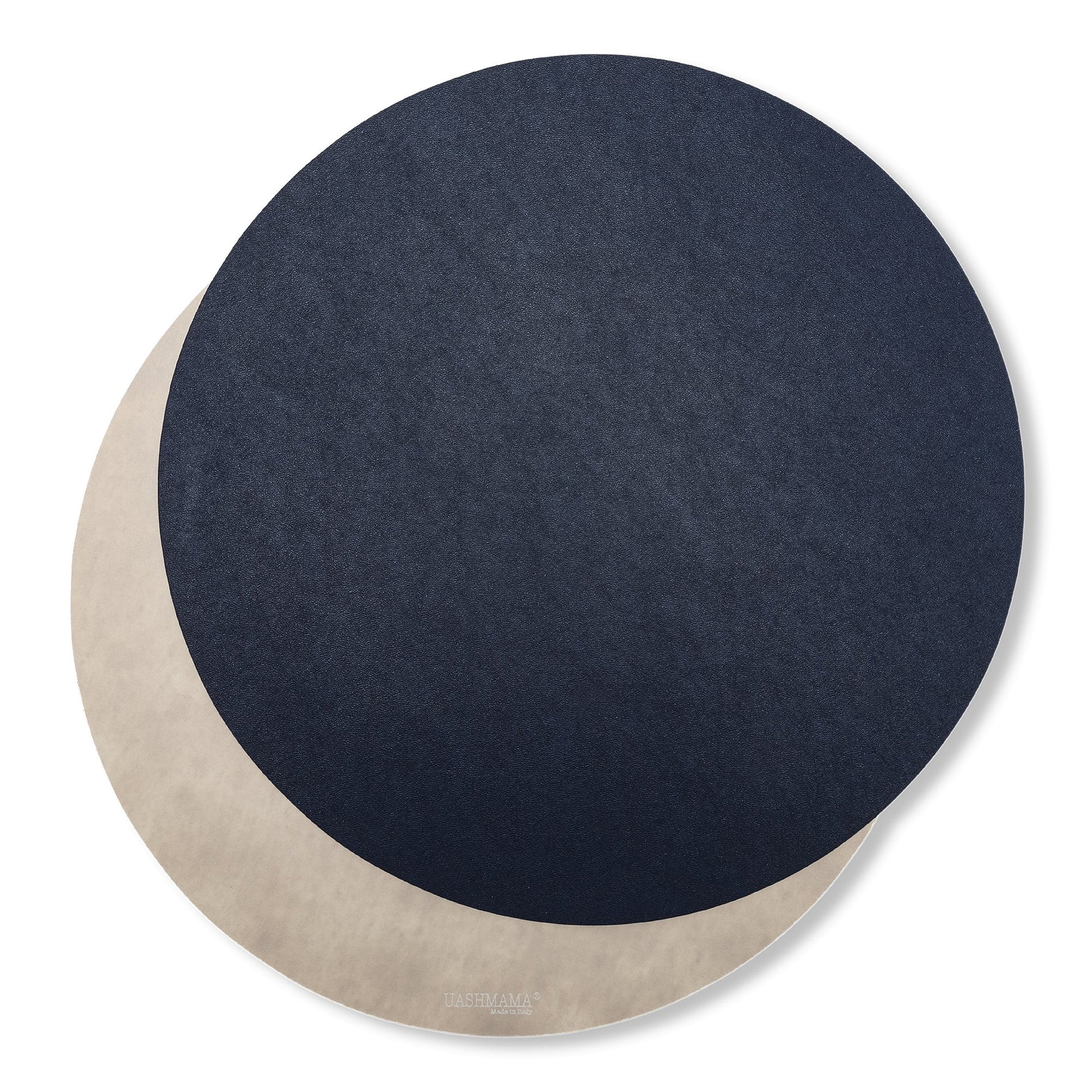 Two round washable paper placemats are shown one on top of the other. The one in the foreground is navy and the one at rear is beige.