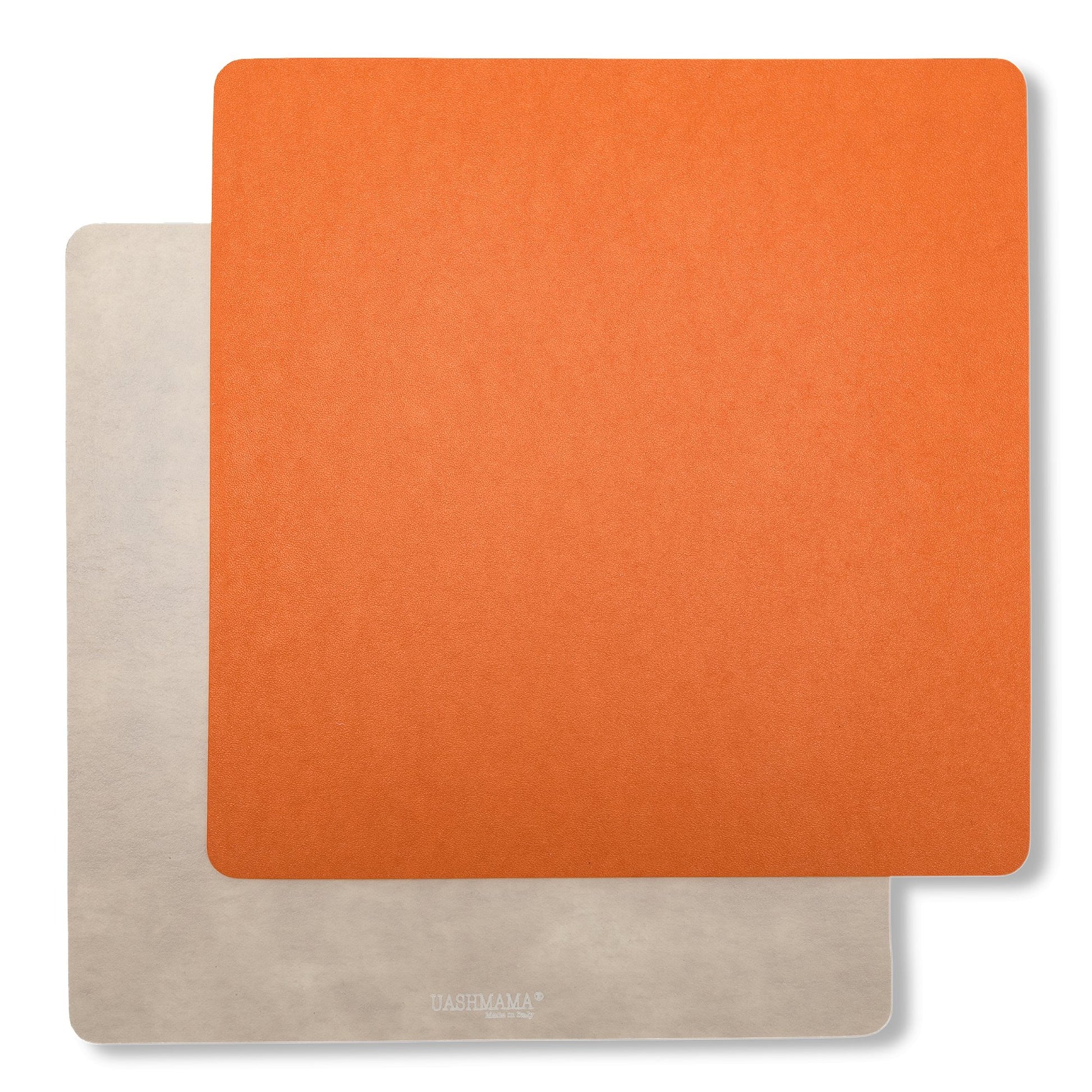Two square washable paper placemats are shown one on top of the other. The one in the foreground is orange and the one at the rear is beige.