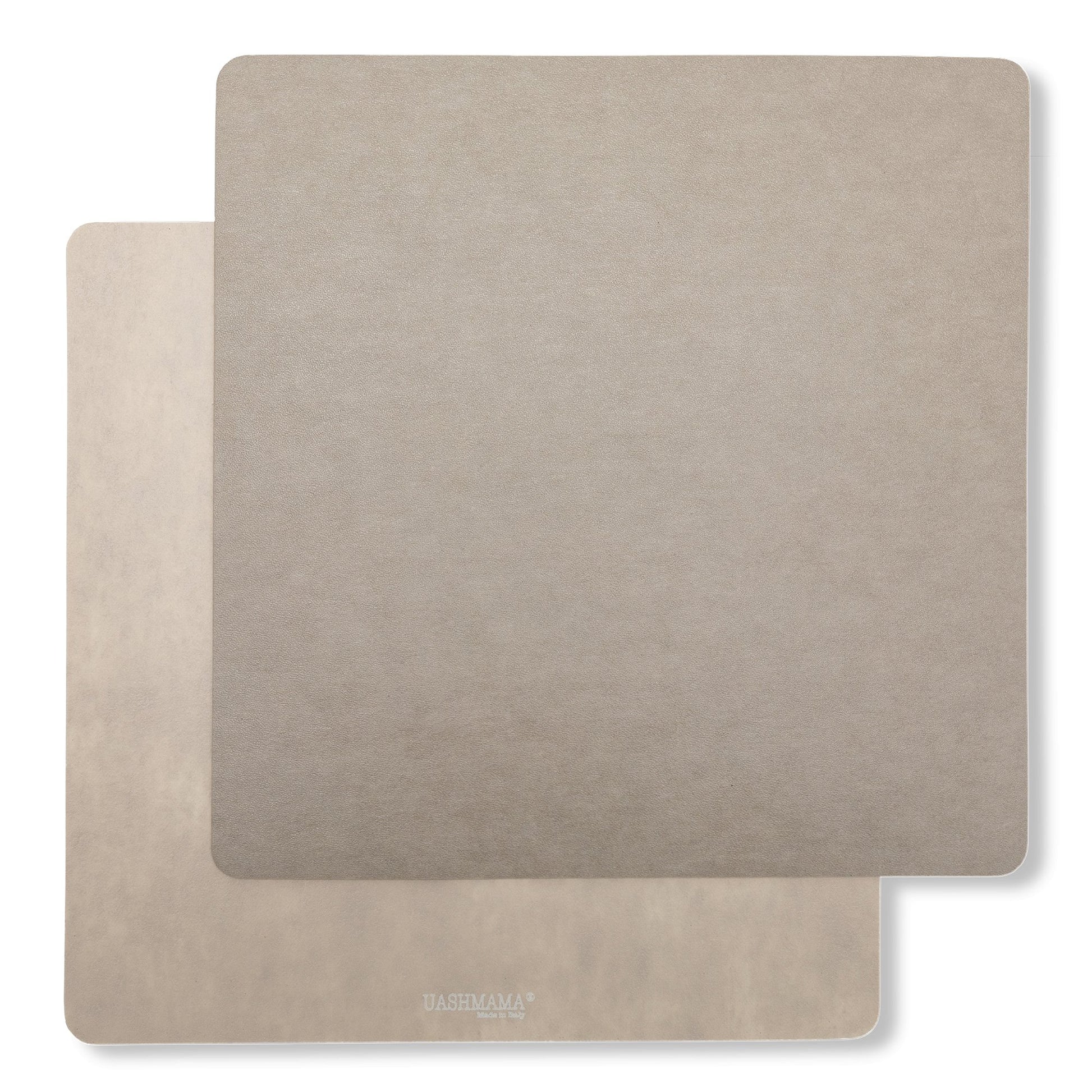 Two square washable paper placemats are shown one on top of the other. The one in the foreground is grey and the one at the rear is beige.