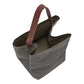 A dark grey washable paper handbag is shown open from the top angle, with a singular brown strap.