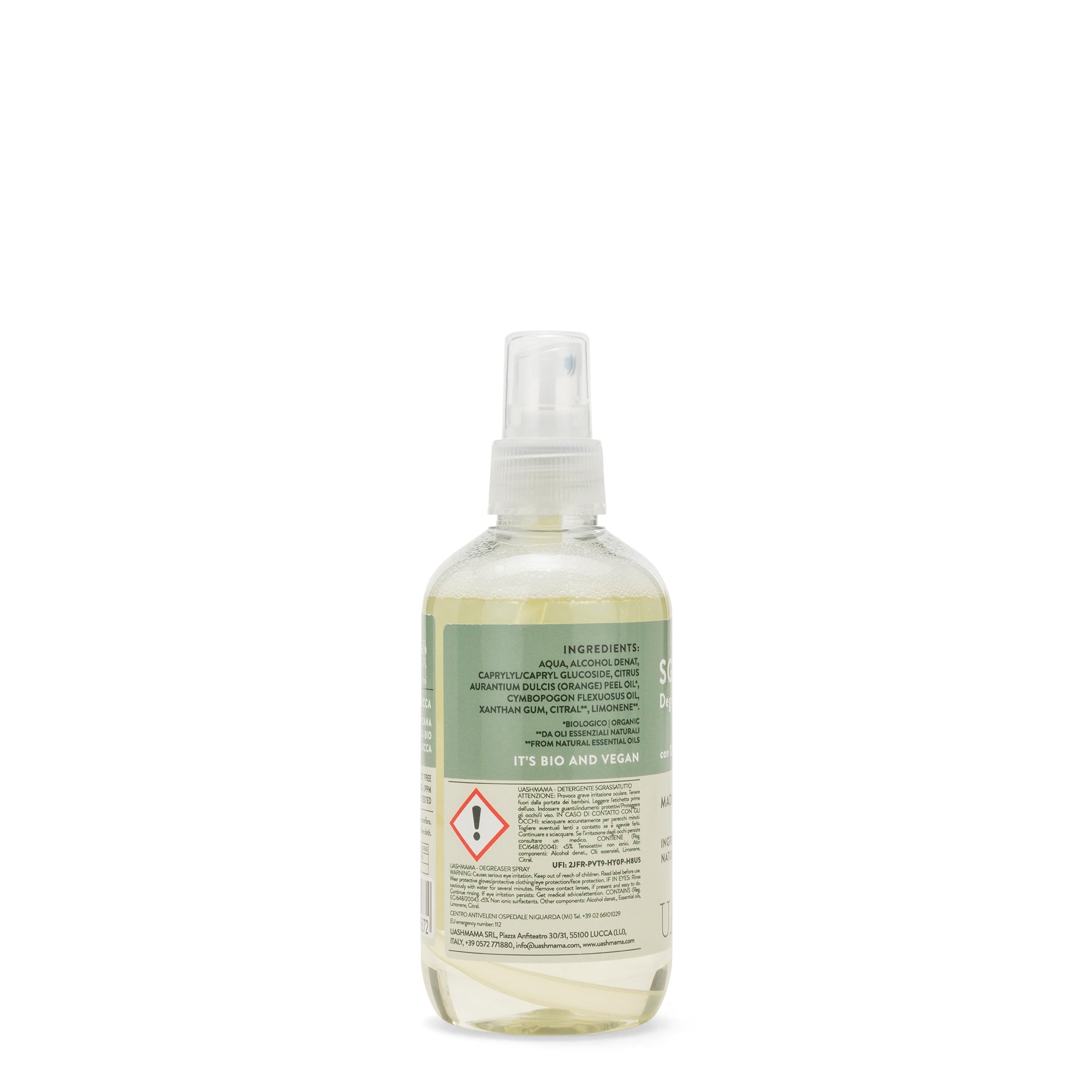 A clear spray bottle is shown from the back displaying the ingredient list on a green and beige label.