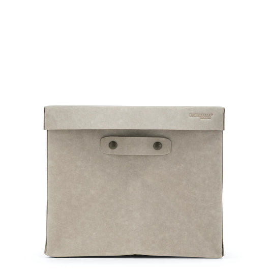 A large washable paper box is shown in grey, with the UASHMAMA logo stamped in the right hand corner of the lid. Two metal studs hold the removable handle in place.