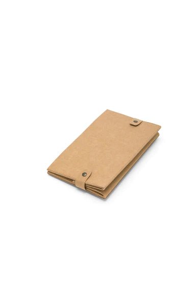 A tan washable paper box is shown folded flat, with metallic stud closures to hold it in place.