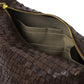 A brown woven washable paper handbag is shown unzipped and open to reveal a beige cotton lining with interior pockets.