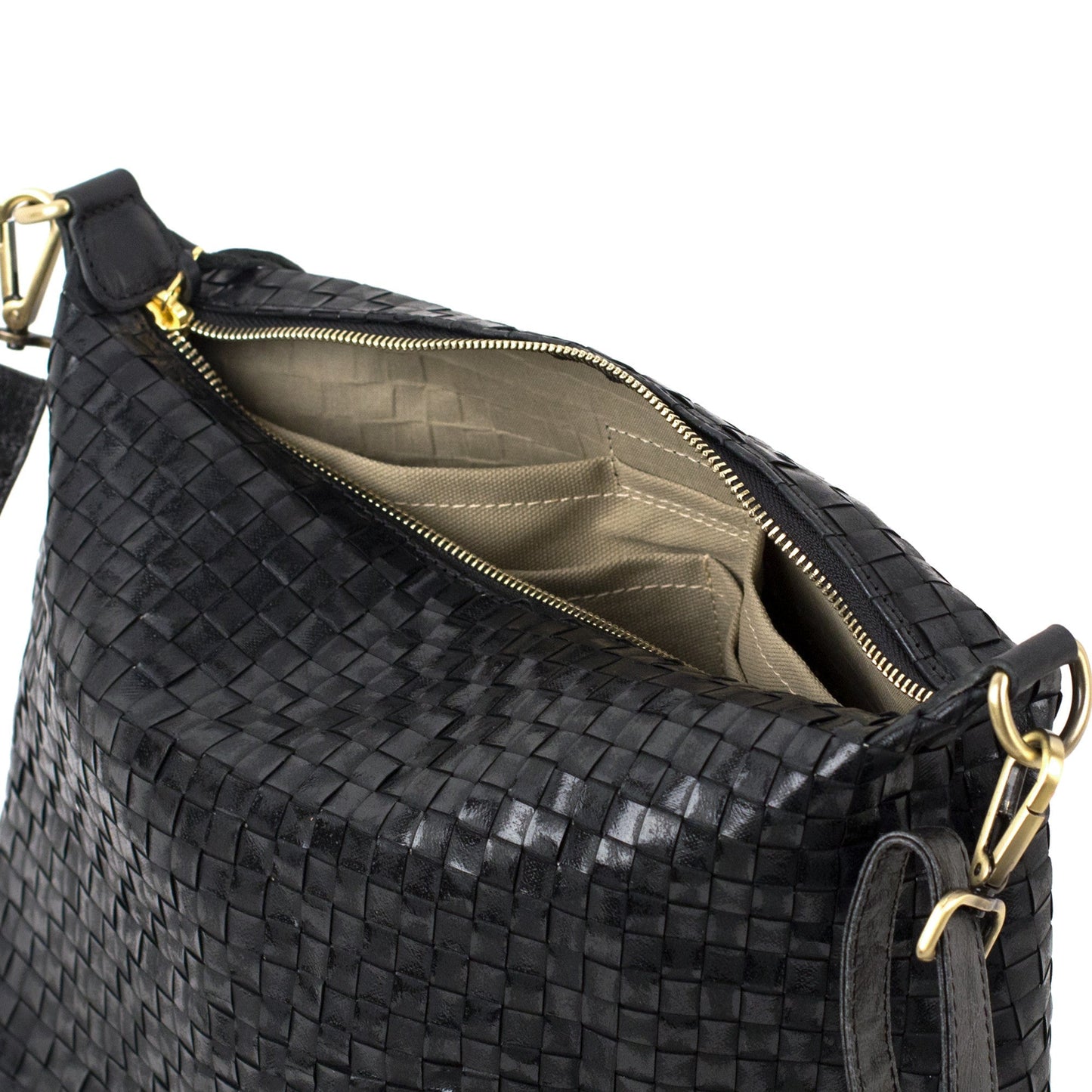 A black woven washable paper handbag is shown unzipped and open to reveal a beige cotton lining with interior pockets.