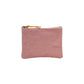 A washable paper pouch is shown from the front in dusky pink, featuring a brown zip toggle.