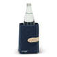 A navy washable paper cooler is shown with a washable paper side tab with silver stud. It contains a glass water bottle.