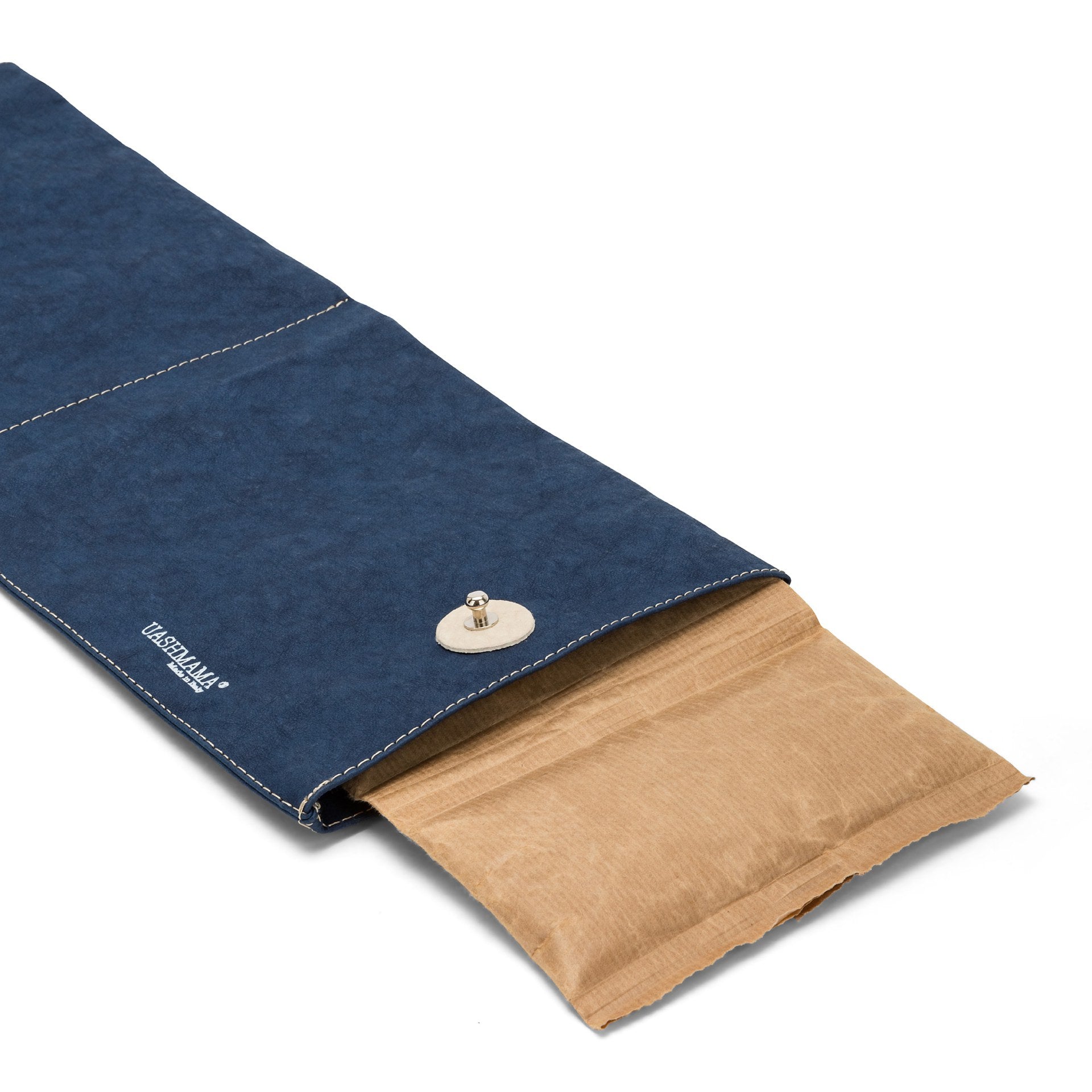 A navy washable paper wine cooler is shown lying flat and open. The freezer insert (brown paper outer) protrudes from one end.