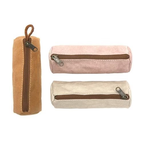 Three oblong paper washable key holders are shown. One in tan, one in dusky pink, and one in beige.