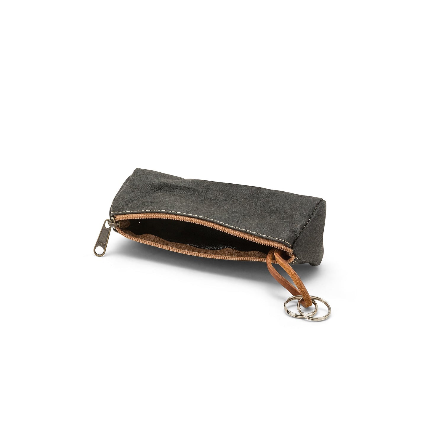 A black washable paper key holder is shown on its side, unzipped.