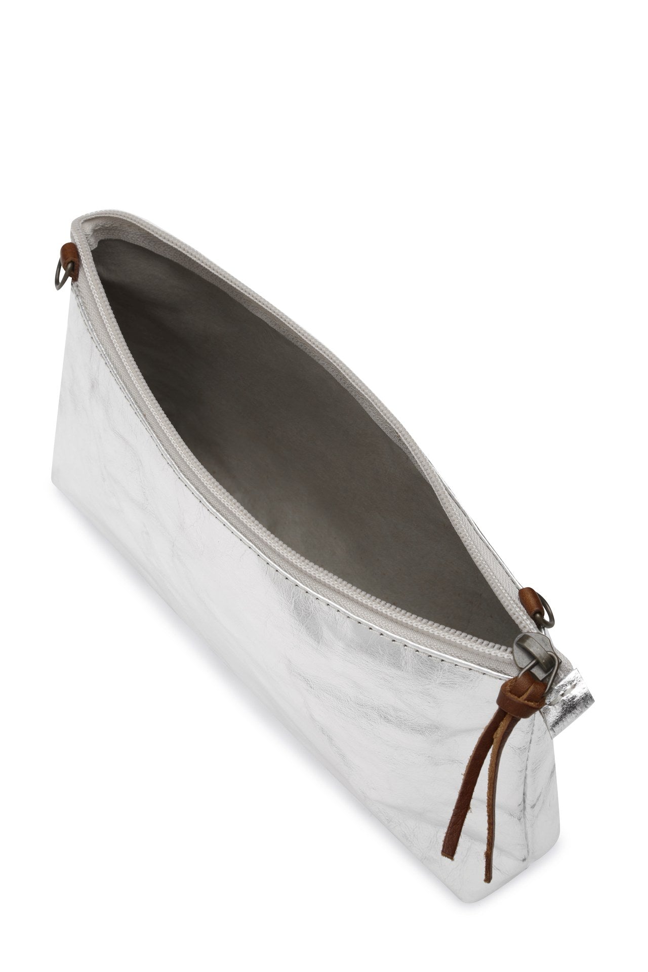 A washable paper bag in metallic silver is shown with the strap removed, open and unzipped with a tan zip toggle.