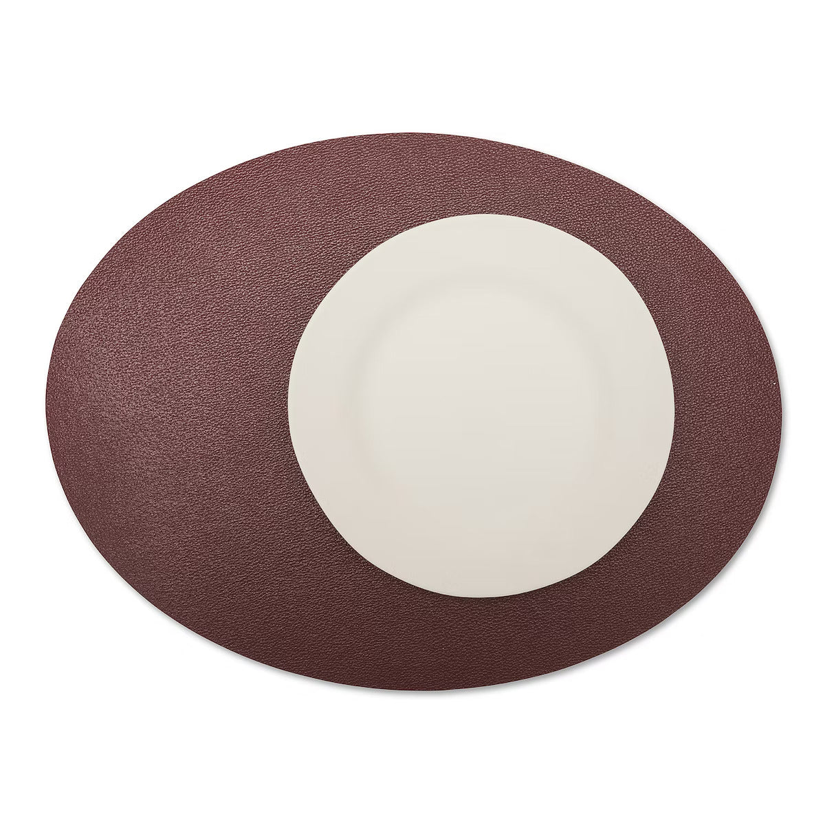A large oval textured washable paper placemat in dark red is shown under a white plate.
